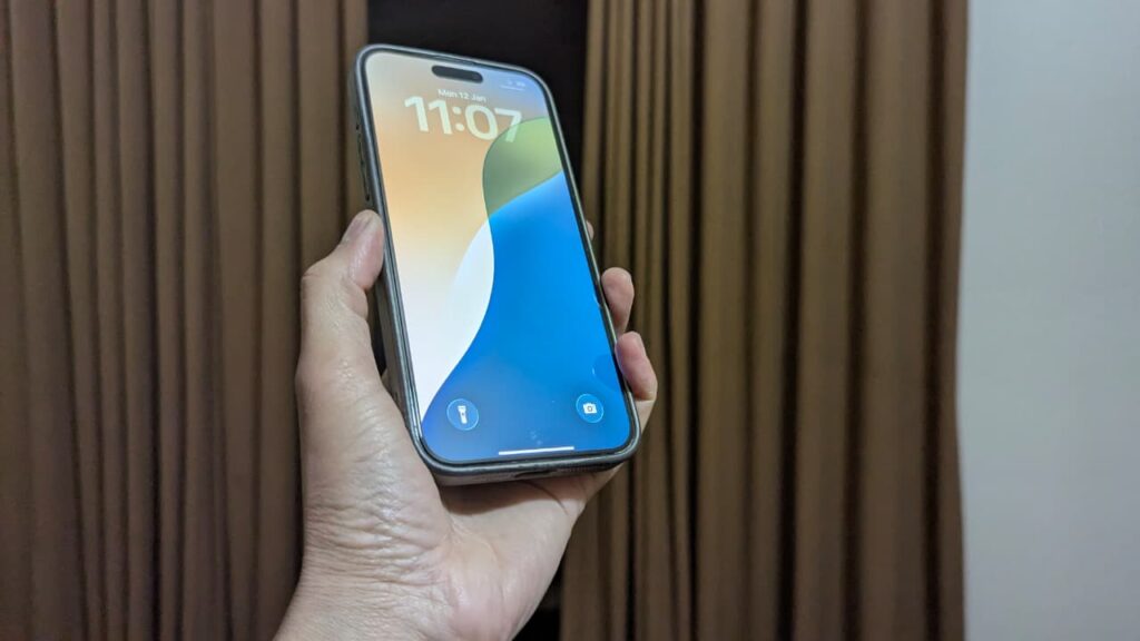 Holding an iPhone 15 Pro Max in the hand